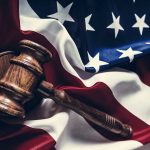 Gavel resting on the American flag.