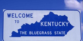 Welcome to Kentucky state sign with blue sky