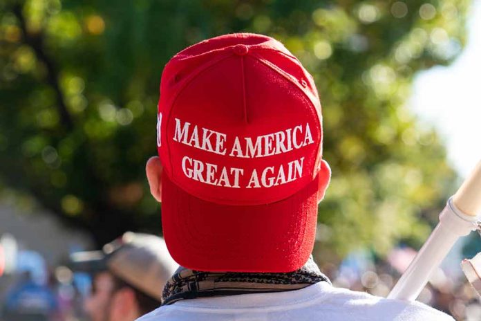 1850438311 featured image Red Make America Great Again hat on person's head.