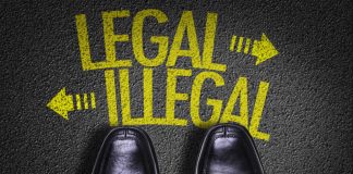 Black shoes facing legal illegal arrows on pavement