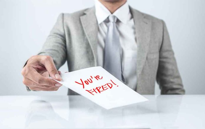 483667948 featured image Person handing a paper with "You're Fired!" text.