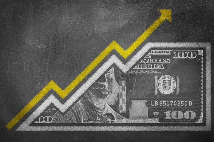 514537495 featured image Dollar bill with upward trending arrow graph overlay