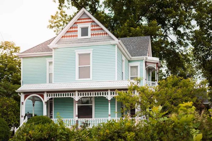 1526393333 featured image Light blue Victorian house with white trim and porch.