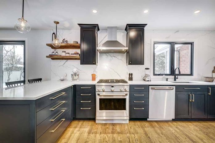 1684127182 featured image Modern kitchen with black cabinets and stainless appliances.