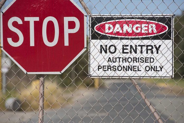 315072221 featured image Stop and Danger signs on a chain-link fence.