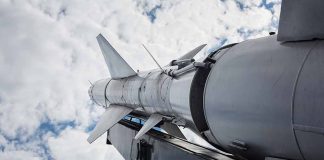 Sky surface-to-air missile rocket tilting upwards.