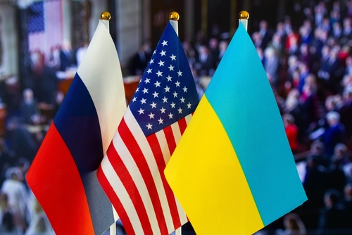 russia-us-ukraine_2100277627 featured image Russian American Ukrainian flags displayed together indoors