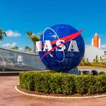 NASA logo sculpture with spaceship and palm trees