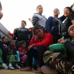 Group of people sitting inside a vehicle