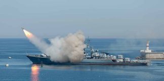Warship firing missile in the sea