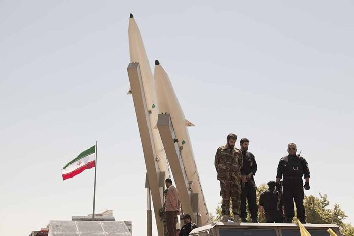 681421708 featured image Military personnel beside missiles and Iranian flag