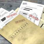 Classified documents with Top Secret stamps on wooden surface