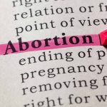 Abortion highlighted in a dictionary with a pink marker