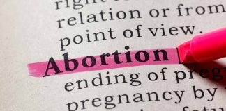 Abortion highlighted in a dictionary with a pink marker