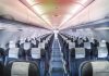 Empty airplane cabin with rows of seats