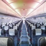 Empty airplane cabin with rows of seats