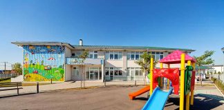 Colorful playground slide in front of a building