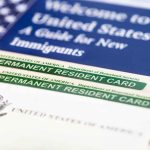 Permanent resident cards with welcome guide and flag