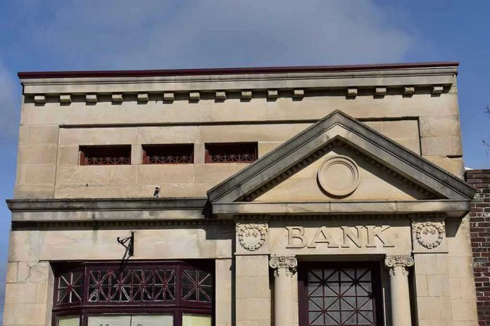 1286239177 Stone building facade with bank sign and columns