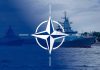 NATO emblem overlaying naval ships in the ocean