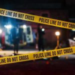 Chaos Erupts: Crowd Clashes with Rogue Driver Yellow police tape in front of crime scene