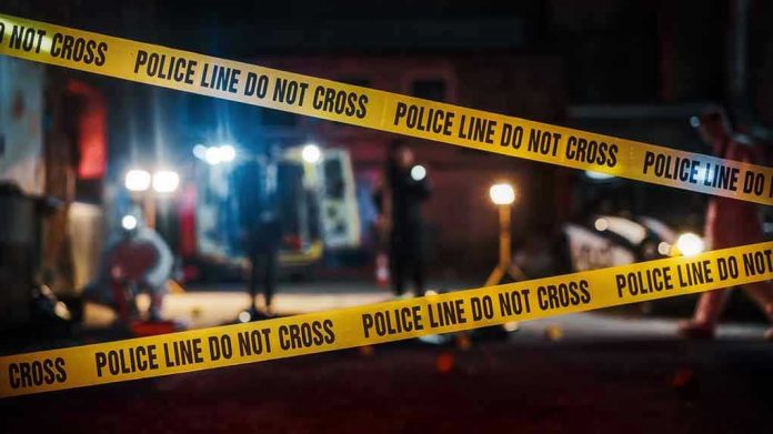 2230645955 Yellow police tape in front of crime scene