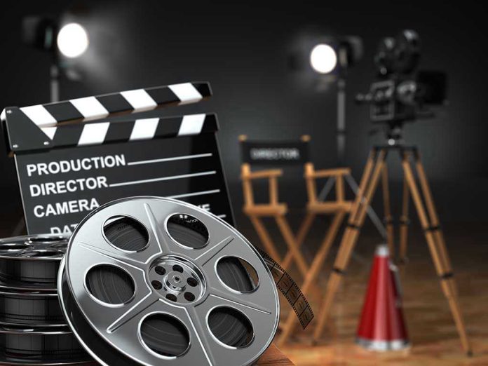 226081837 Movie set with film reels and clapperboard