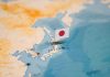 Map of Japan with flag pin placed nearby