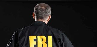 Person wearing jacket with FBI printed on back
