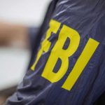 Jacket with FBI letters in yellow
