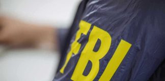 Jacket with FBI letters in yellow