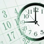 A clock overlaying a calendar illustrating the concept of time management