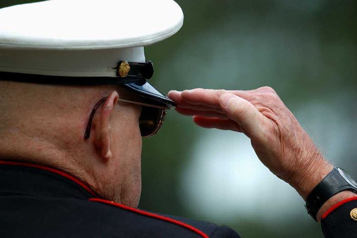 shutterstock_2023674.jpg A veteran in military uniform saluting with a hand raised