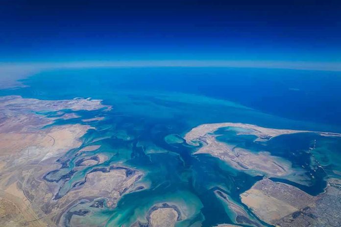 Aerial view of coastline and ocean.