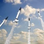 Diplomacy SHATTERED: Putin Defies Trump Deal Multiple missiles launching into a cloudy sky