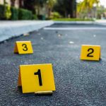 Crime scene markers on asphalt