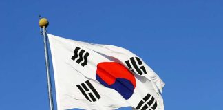 South Korean flag waving against a clear blue sky