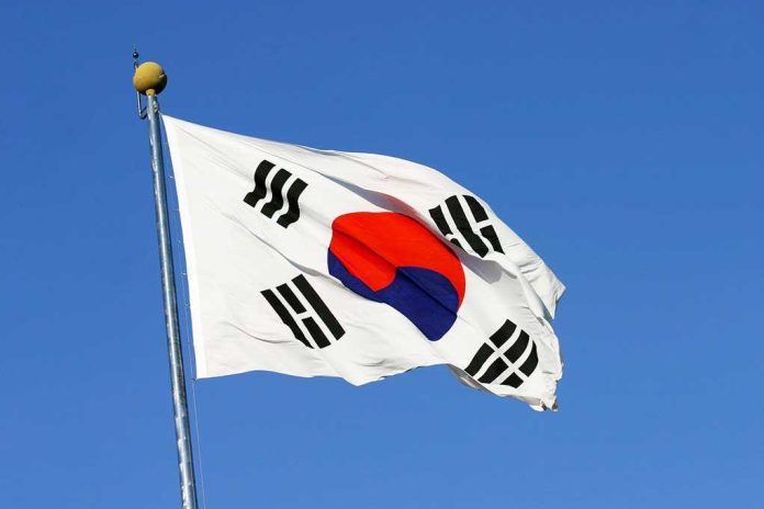 South Korean flag waving against a clear blue sky