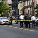 Bullets FLY After Trump Banner Torn Down Police gathered at an urban crime scene.