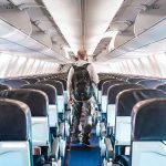 Emergency Landing After BRUTAL Crew Attack Person walking down empty airplane aisle