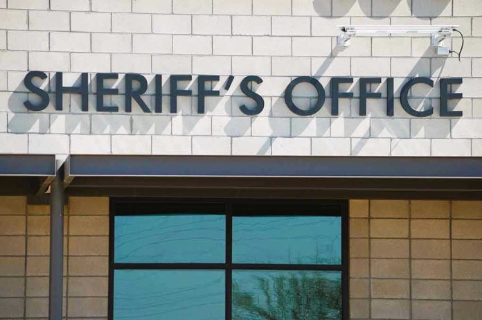 Sheriffs Office sign on brick building faade.