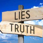 Reagan Sabotage Story EXPOSED As Fiction Signs pointing to Lies and Truth against sky.