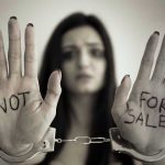 Brothel Sting EXPOSED – Chilling Trafficking Ring! Handcuffed woman shows NOT FOR SALE on her palms.