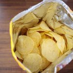 Open bag of ridged potato chips