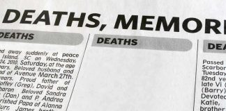 Newspaper obituary section with death notices.