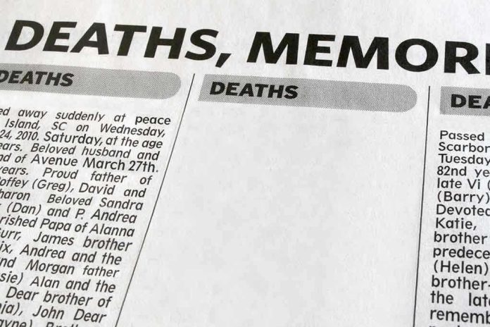 Newspaper obituary section with death notices.