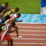Runners sprinting at the start of a race during the Olympics