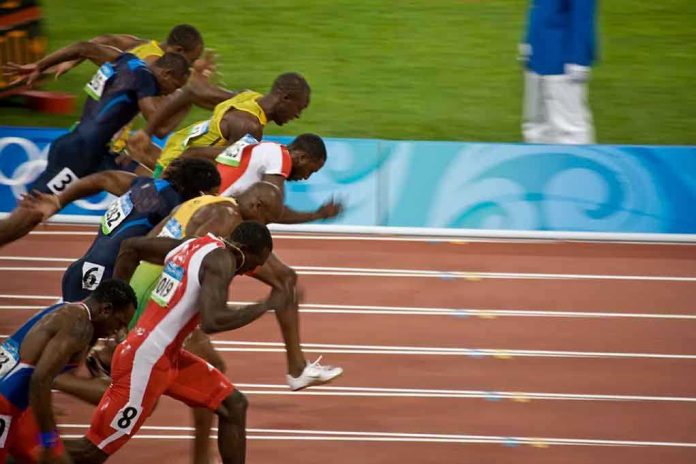 Runners sprinting at the start of a race during the Olympics