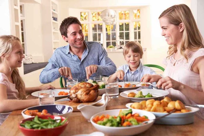 A family enjoying a dinner together at a table filled with food