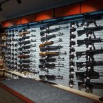 Shocking Regulations Threaten Second Amendment Wall-mounted guns displayed in a store.
